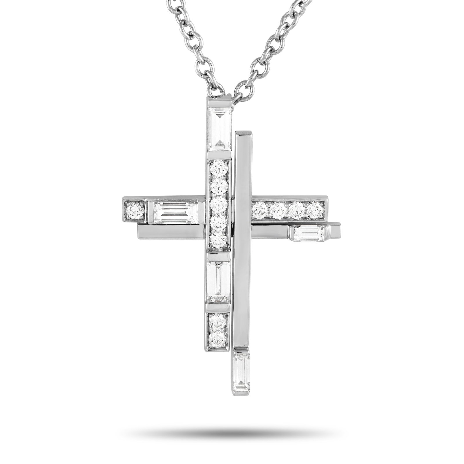 Harry Winston Symbols Platinum 0.72ct Diamond Cross Necklace: This Harry Winston cross necklace allows you to share the light of your faith. It is exquisitely crafted in 950 platinum and embellished with 12 round brilliant diamonds and five baguette diamonds. Th
