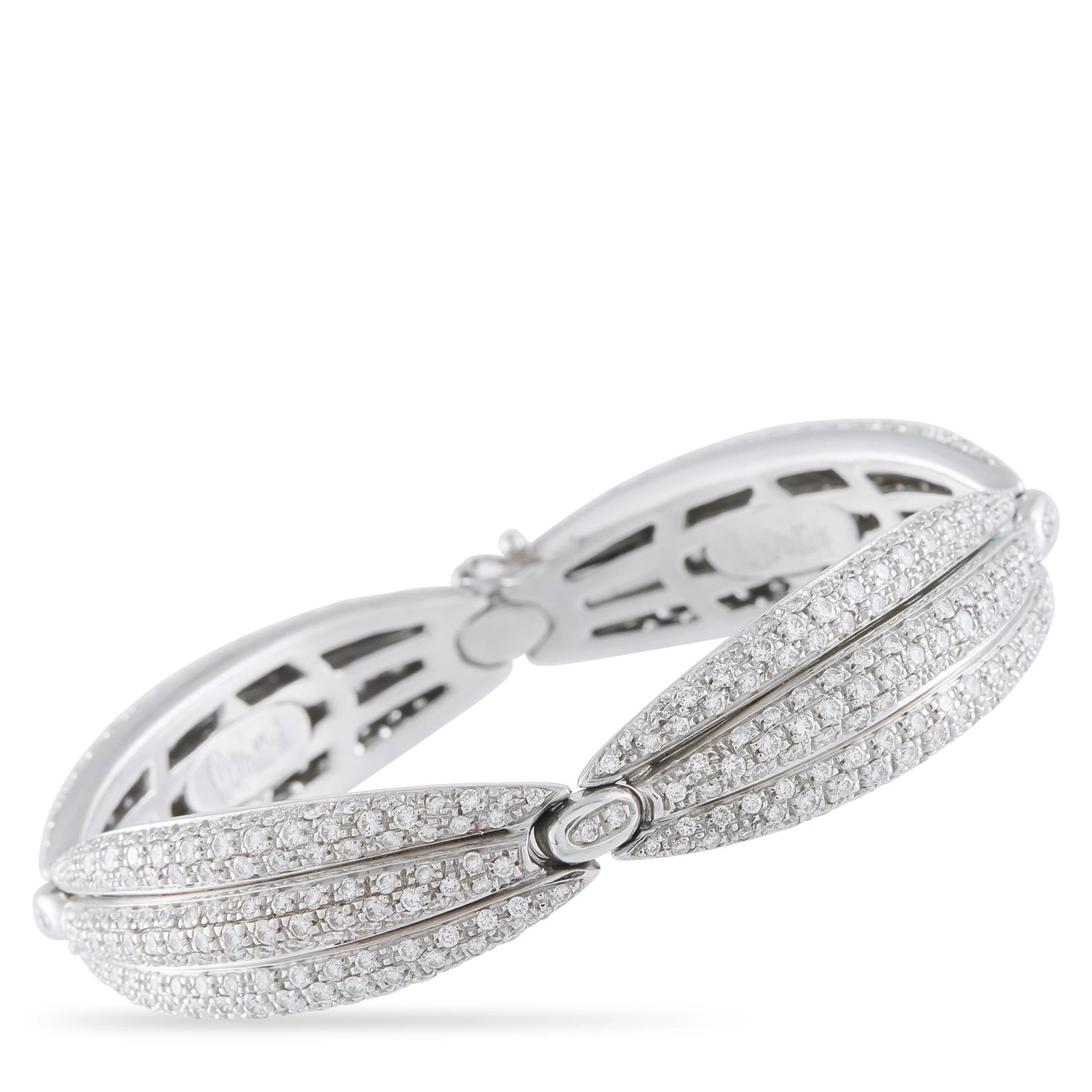 Damiani 18K White Gold 8.0ct Diamond Bracelet: This Damiani bracelet is crafted in 18K white gold with a wide, hinged, scalloped leaf-inspired design pavé-set throughout with round brilliant diamonds totaling approximately 8.00 carats. It is