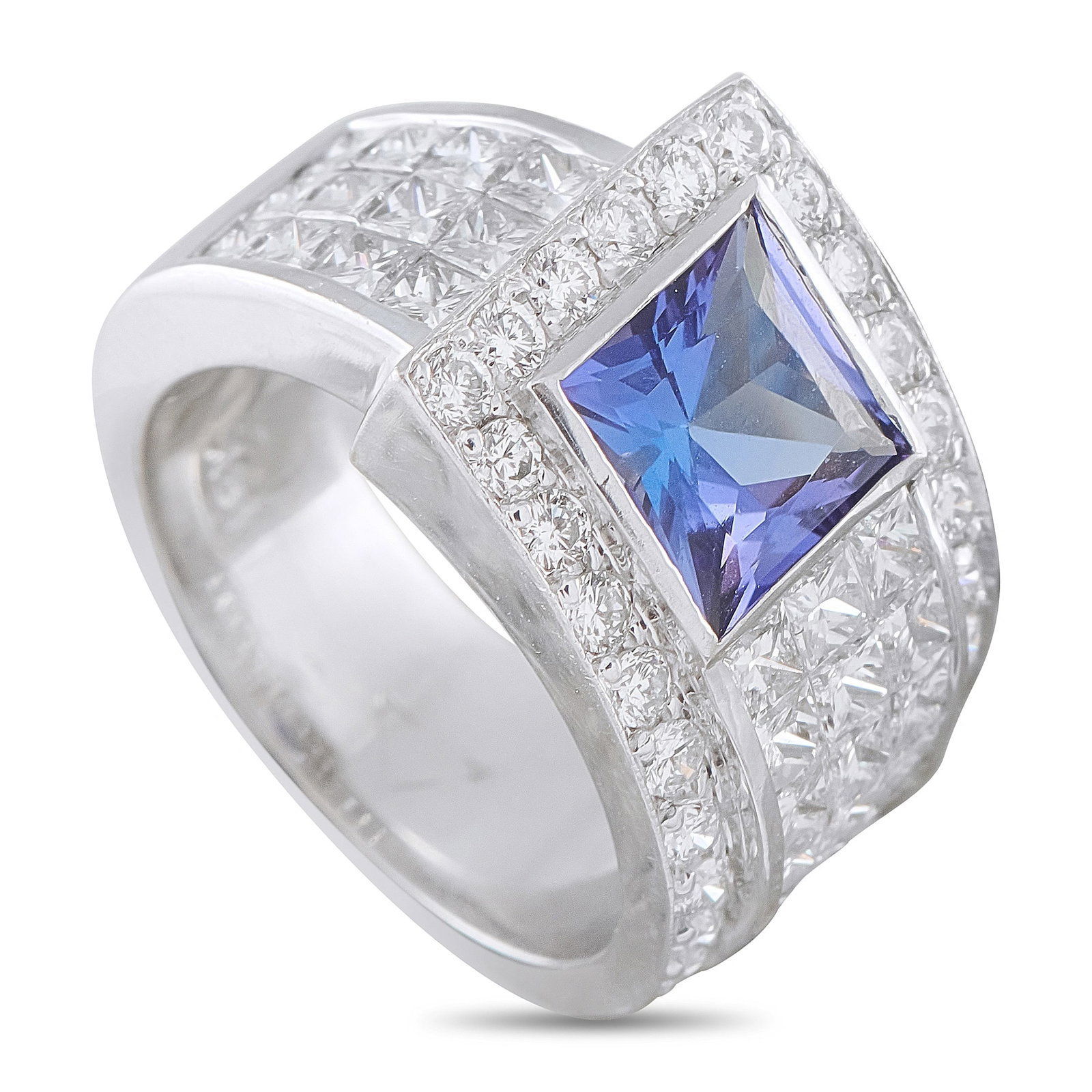 18K White Gold 1.65ct Diamond and Tanzanite Ring: This ring is crafted in 18K white gold and centers on a vivid square-cut tanzanite of approximately 1.85 carats, bezel-set and bordered by channel and pave-set round and princess-cut diamonds