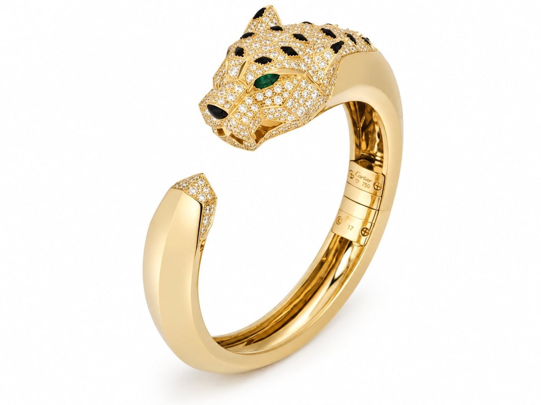 Cartier Yellow Gold and 4.33ct Diamond Panthere De Cartier Bracelet: Cartier Yellow Gold and 4.33ct Diamond Panthere De Cartier Bracelet An 18k yellow gold diamond, emerald and onyx Cartier bracelet from the Panthere De Cartier collection. The bracelet features the ico