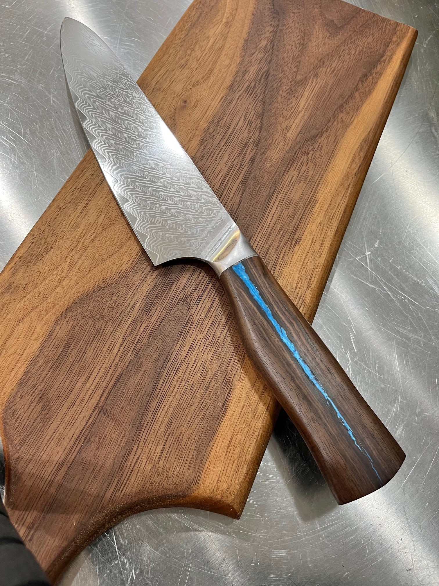 High End, Handmade, Professional Chef Knife with Black Walnut Handle: This is a very limited edition, custom made, professional chef knife. Do some searches. You won't find a knife like this anywhere else. Each one is a completely unique work of art. This knife is made 