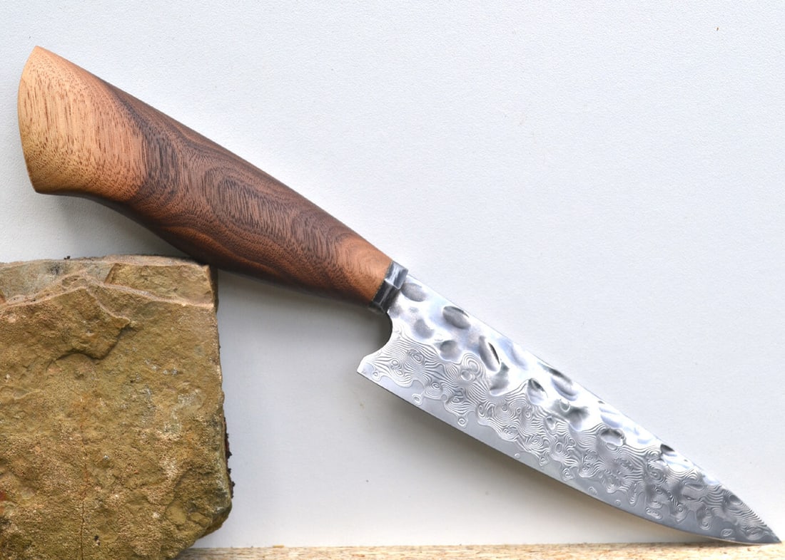 High End, Handmade, Professional Chef Knife with Black Walnut Handle: This is a very limited edition, custom made, professional chef knife. Do some searches. You won't find a knife like this anywhere else. Each one is a completely unique work of art. This knife is made 