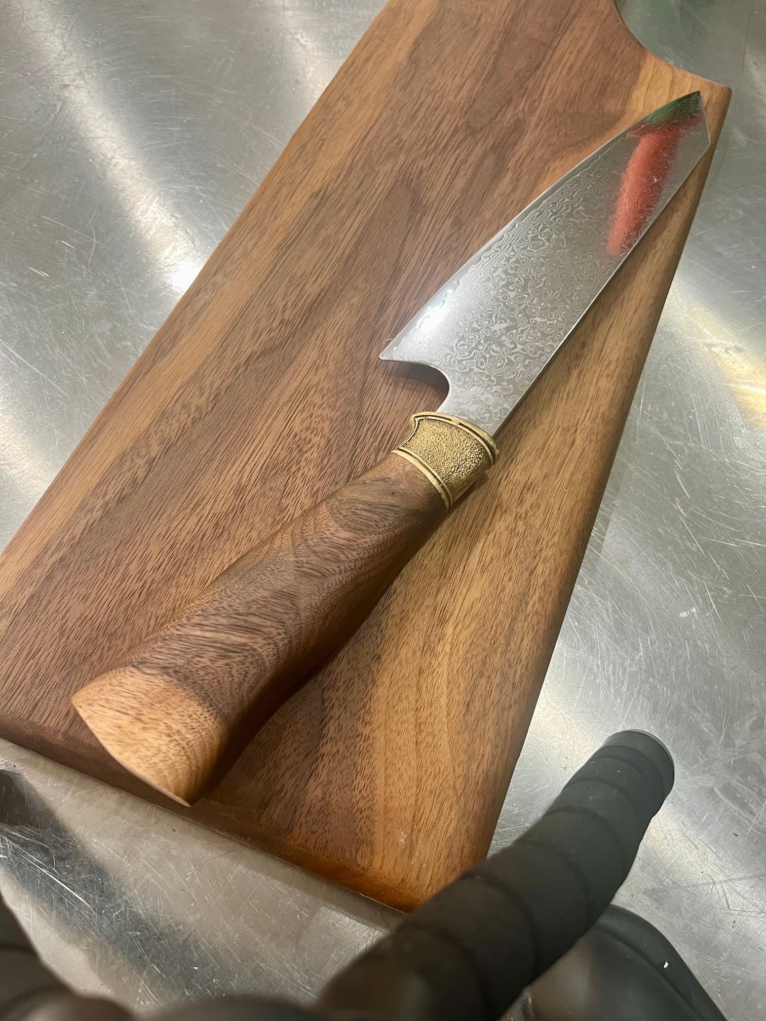 High End, Handmade, Professional Chef Knife with Walnut Handle: This is a very limited edition, custom made, professional chef knife. Do some searches. You won't find a knife like this anywhere else. Each one is a completely unique work of art. This knife is made