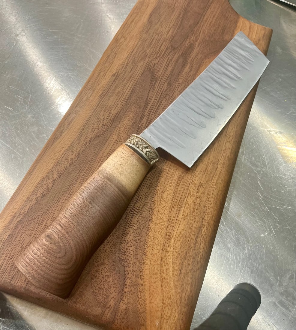 High End, Handmade, Professional Chef Knife with Walnut Handle: This is a very limited edition, custom made, professional chef knife. Do some searches. You won't find a knife like this anywhere else. Each one is a completely unique work of art. This knife is made