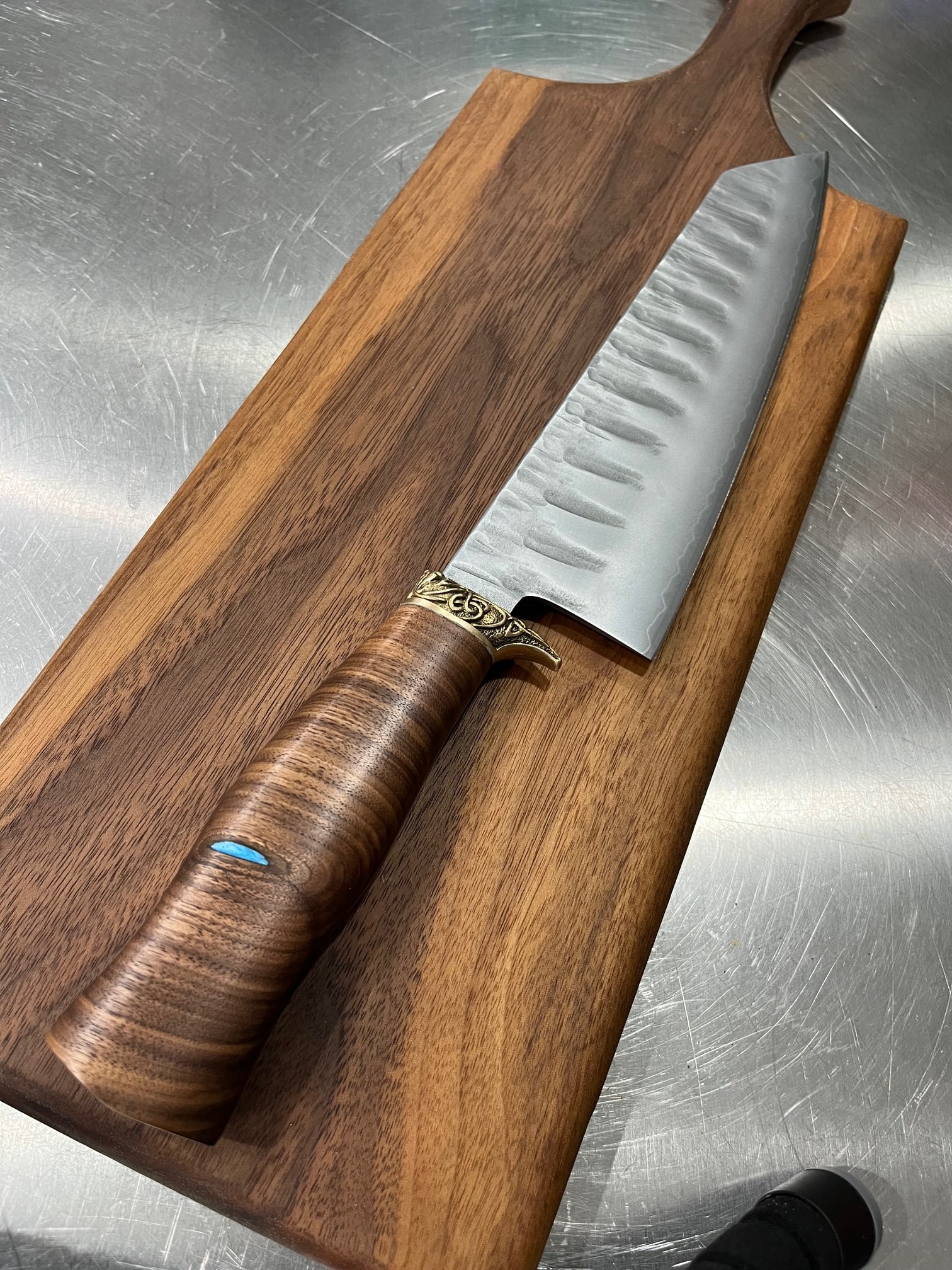 High End, Handmade, Professional Chef Knife with Black Walnut Handle: This is a very limited edition, custom made, professional chef knife. Do some searches. You won't find a knife like this anywhere else. Each one is a completely unique work of art. This knife is made