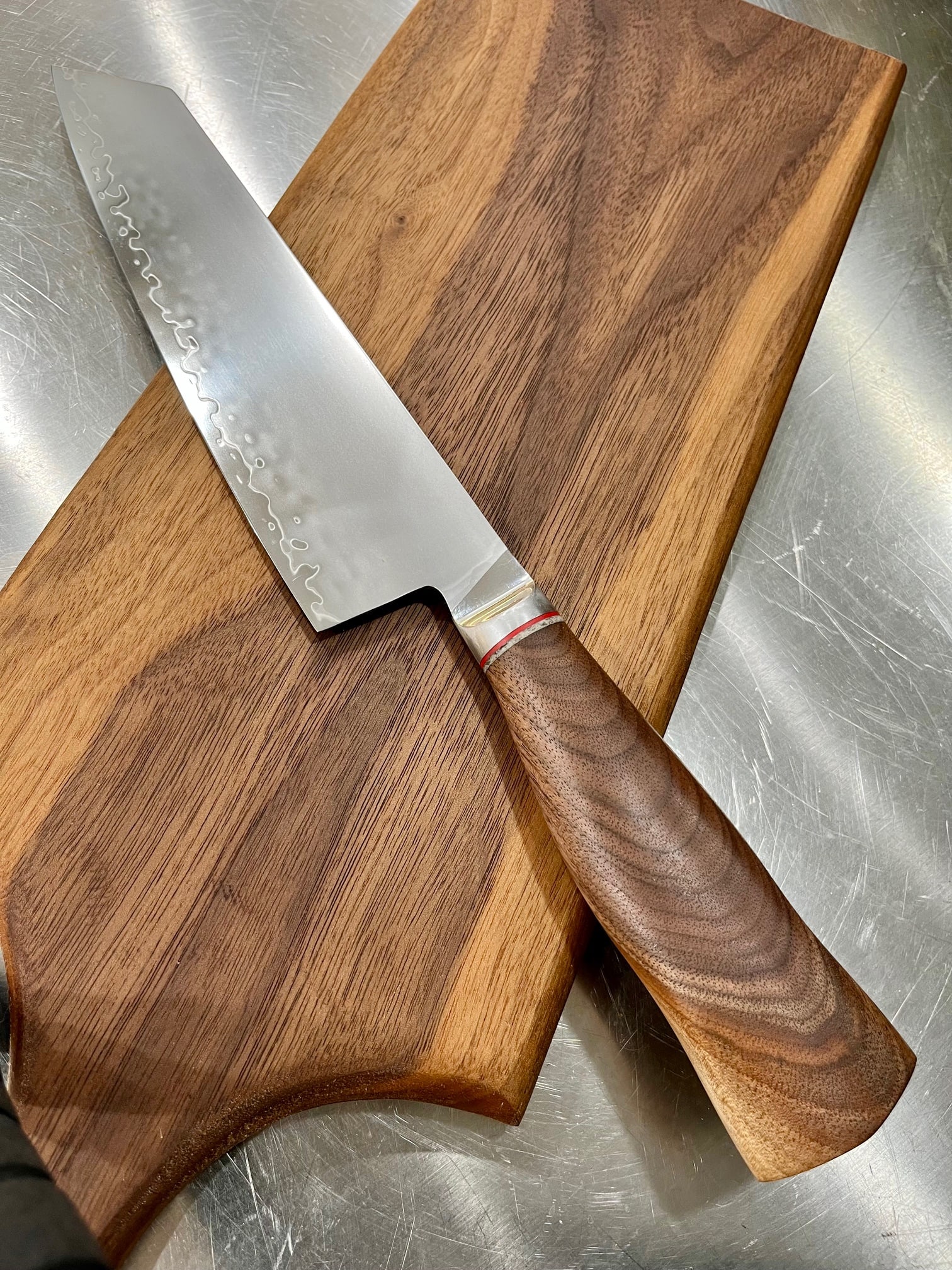 High End, Handmade, Professional Chef Knife with Black Walnut Handle: This is a very limited edition, custom made, professional chef knife. Do some searches. You won't find a knife like this anywhere else. Each one is a completely unique work of art. This knife is made