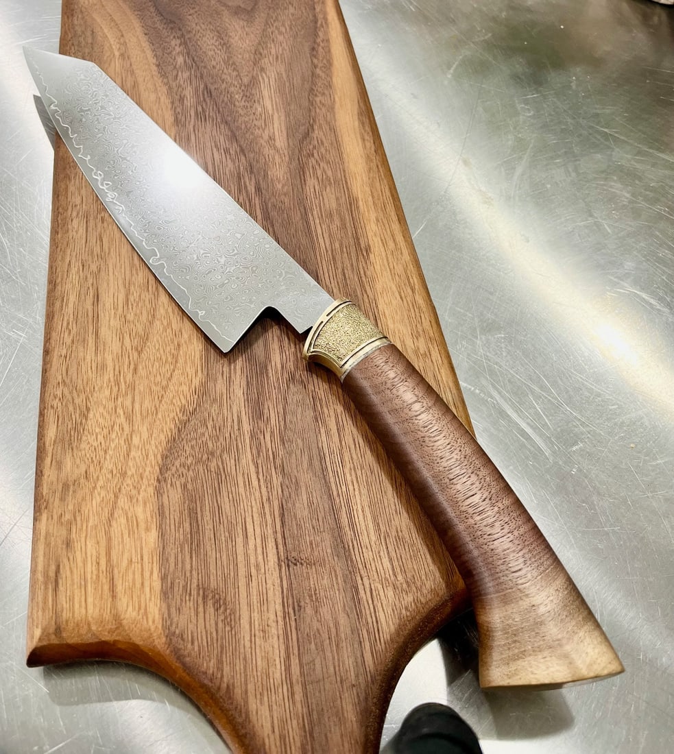 High End, Handmade, Professional Chef Knife with Black Walnut Handle: This is a very limited edition, custom made, professional chef knife. Do some searches. You won't find a knife like this anywhere else. Each one is a completely unique work of art. This knife is made 