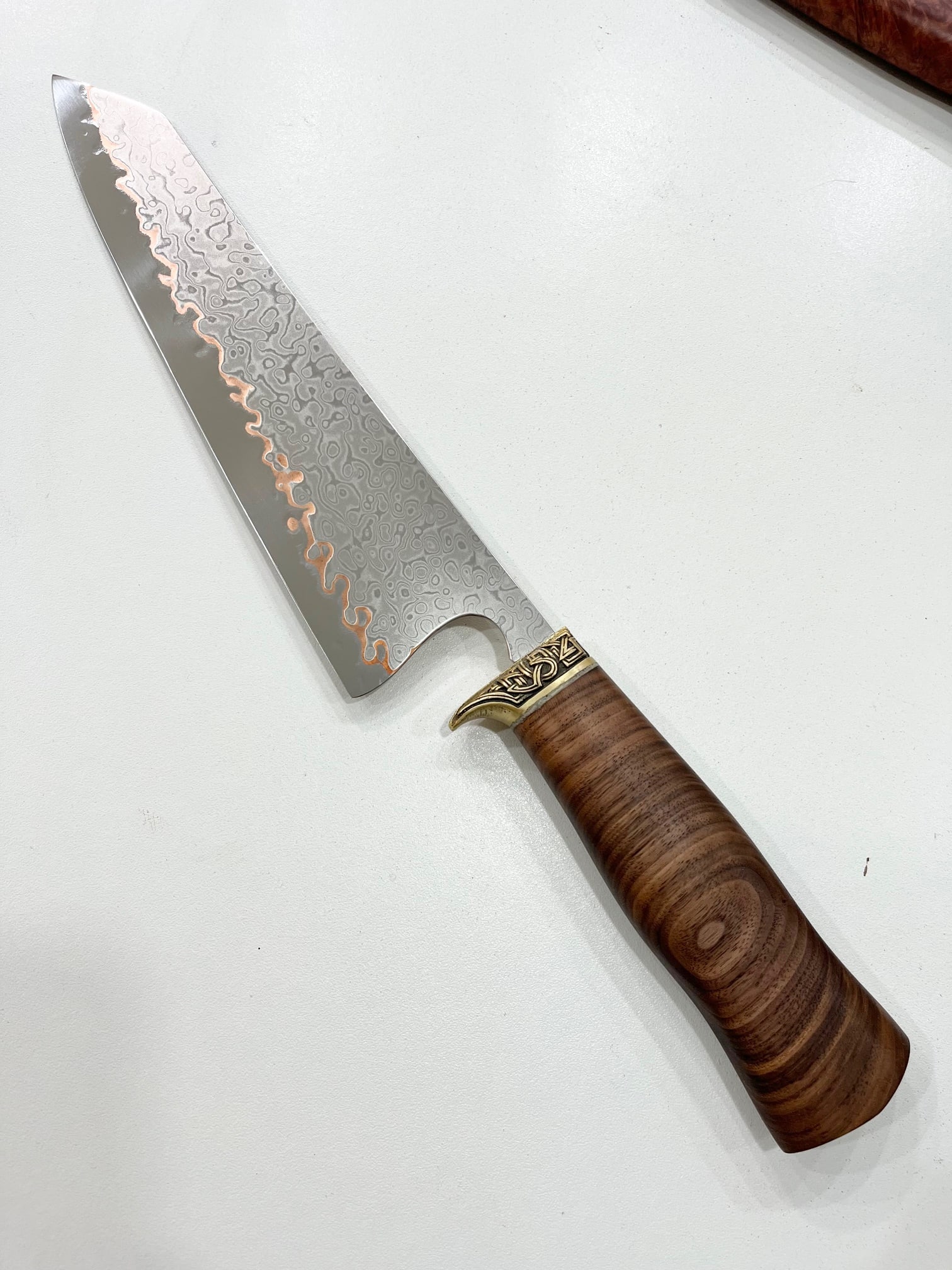 High End, Handmade, Professional Chef Knife with Black Walnut Handle: This is a very limited edition, custom made, professional chef knife. Do some searches. You won't find a knife like this anywhere else. Each one is a completely unique work of art. This knife is made