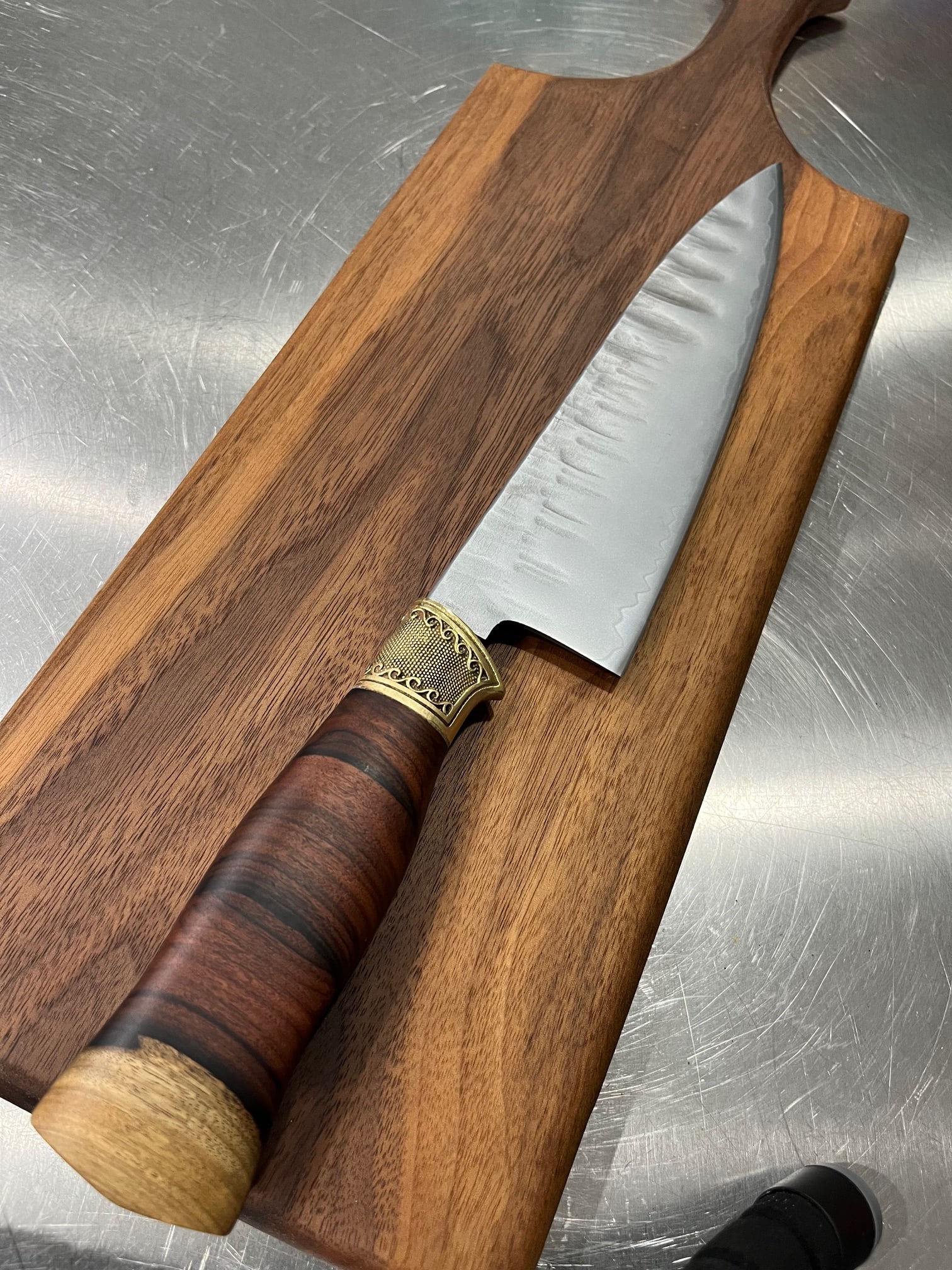 High End, Handmade, Professional Chef Knife with Bolivian Rosewood Handle: This is a very limited edition, custom made, professional chef knife. Do some searches. You won't find a knife like this anywhere else. Each one is a completely unique work of art. This knife is made 
