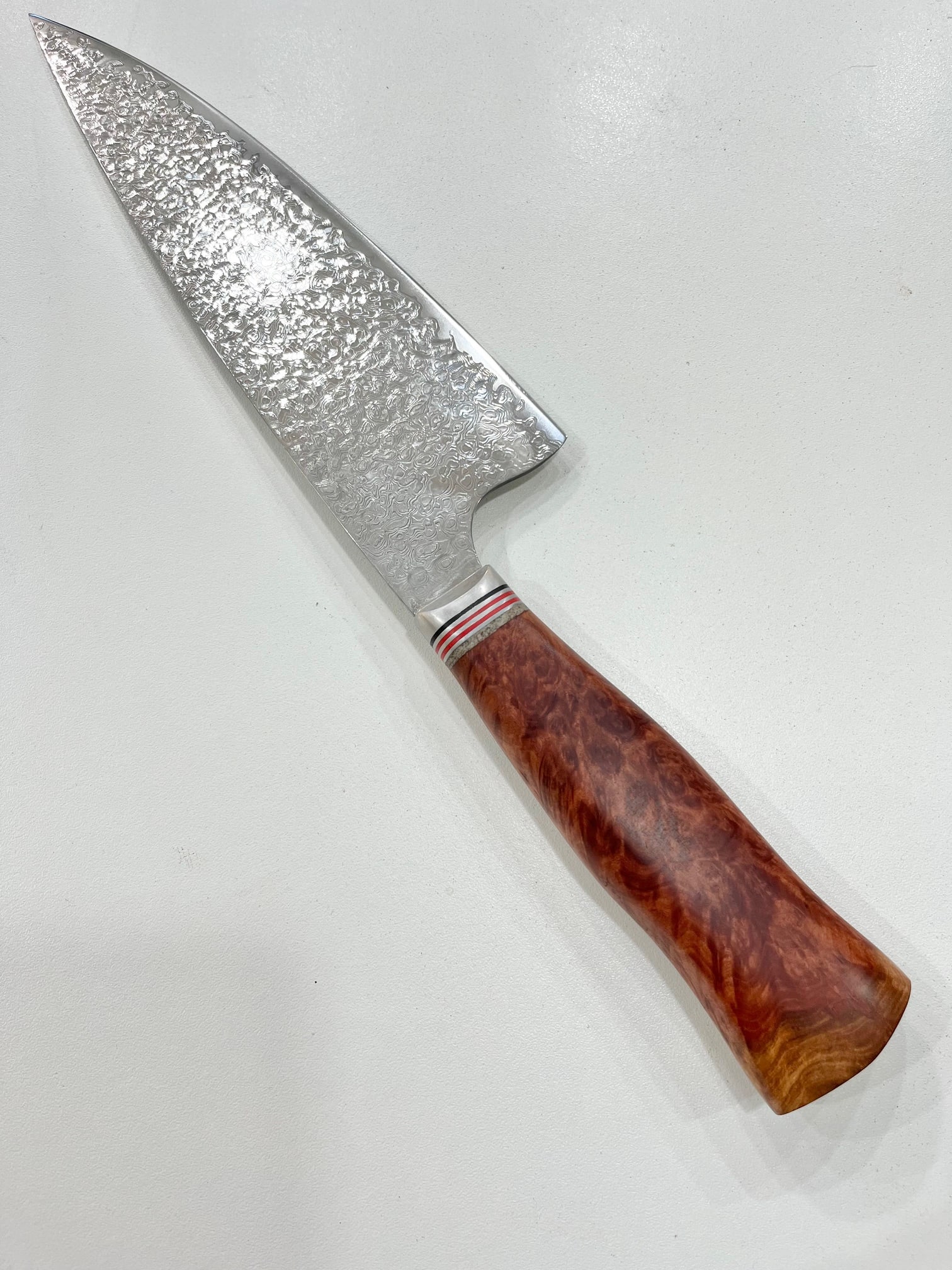 High End, Handmade, Professional Chef Knife with Amboyna Burl Handle: This is a very limited edition, custom made, professional chef knife. Do some searches. You won't find a knife like this anywhere else. Each one is a completely unique work of art. This knife is made 