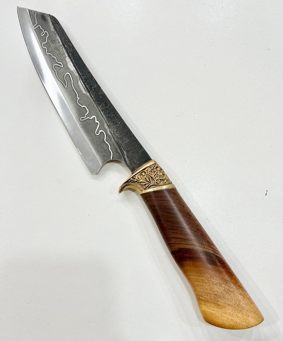 High End, Handmade, Professional Chef Knife with Black Walnut Handle: This is a very limited edition, custom made, professional chef knife. Do some searches. You won't find a knife like this anywhere else. Each one is a completely unique work of art. This knife is made 