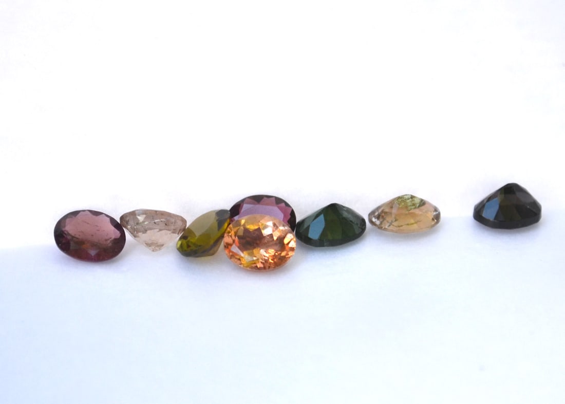 4.58 Carat Parcel of Oval Cut Tourmalines: Nice Tourmalines. Good variety of color. Natural and untreated. These were originally meant to be sold individually at the price per carat written on the paper. We're selling them all together at 75%