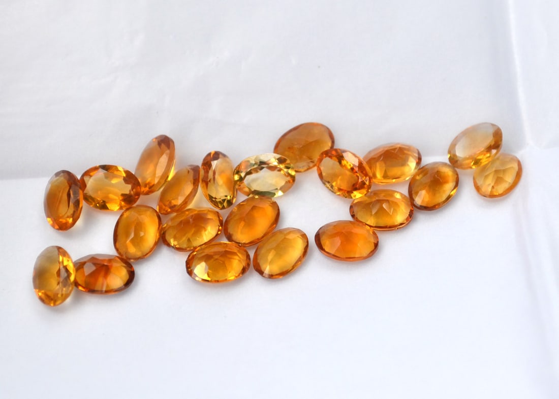 12.79 Carats of Oval Cut Citrine: Beautiful, jewelry grade Citrine here. Natural and untreated. These were originally meant to be sold individually at the price per carat written on the paper. We're selling them all together at 75% of