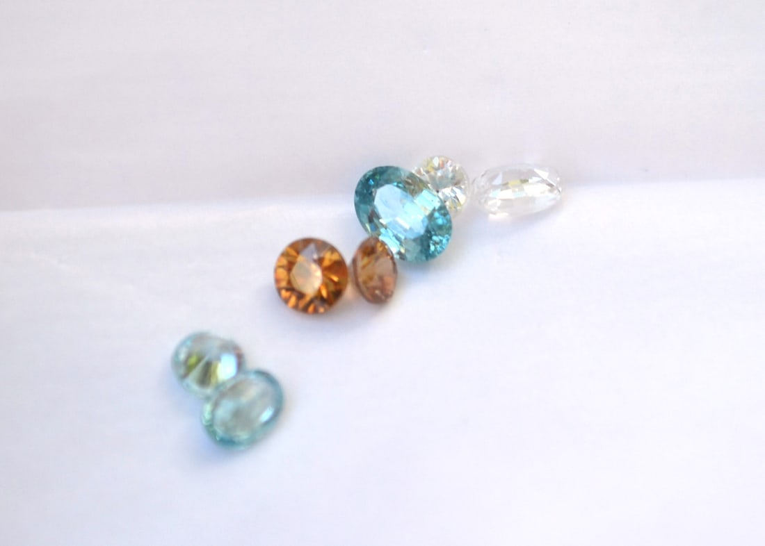 4.36 Carat Parcel of Zircons: Beautiful Zircons here. Great stones with rich color, beautiful cutting and great clarity. Awesome parcel for the price. Natural and untreated. These were originally meant to be sold individually at