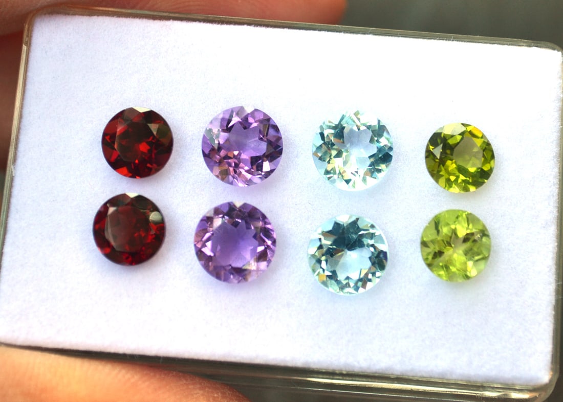 14.10 Carats of Jewelry Grade Matched Pairs: Very nice set of jewelry grade matched pairs. Just a great set of stones at a great price. The peridots have a few minor inclusions, which is most likely why the price was set so cheaply on those.