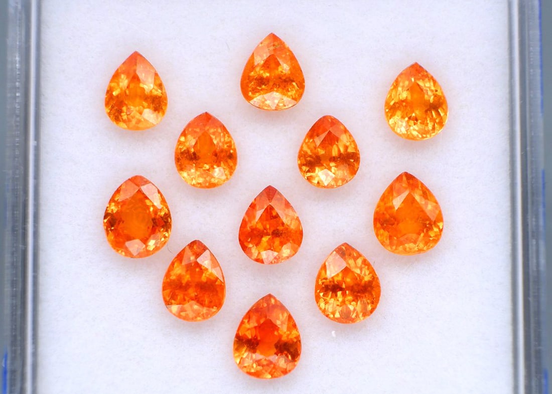 6.82 Carat Set of Jewelry Grade Spessartite Garnets: Wow, what a stunning set of top, Mandarin Orange, Spessartite Garnets. Just exceptional. Wonderful pear cuts. For Proxibid bidders, shipping is a flat rate of $6, no matter how many lots won. For Live