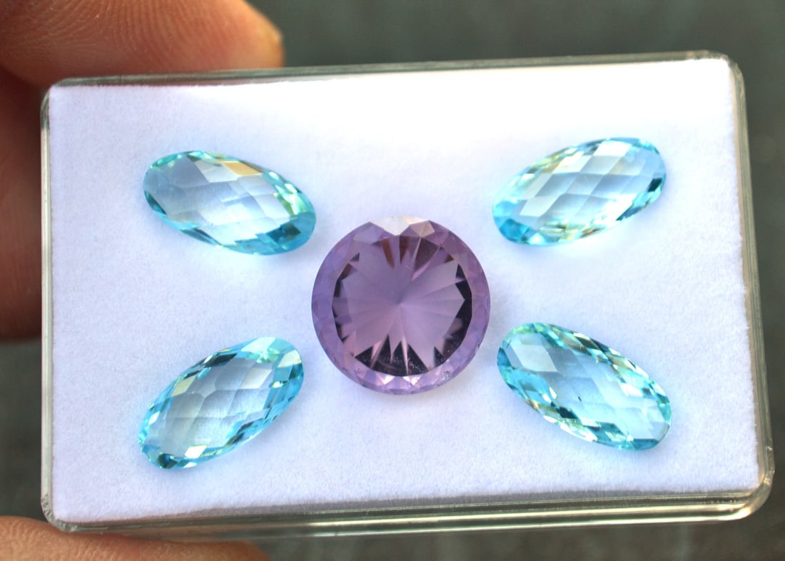 24.34 Carats of Jewelry Grade Amethyst and Topaz: Fantastic set of jewelry grade Amethyst and Topaz. The Amethyst has a butterfly frosted on the pavilion side and the Topaz' are all beautifully arranged as wings to accent the Amethyst. All in all, a