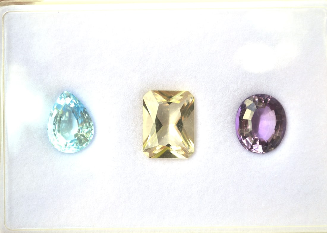 27.57 Carat Trio of Jewelry Grade Labradorite, Topaz and Amethyst: Gorgeous set of jewelry grade gems here. The Labradorite weighs 10.16 carats. The Topaz weighs 10.14 carats. And the Amethyst weighs 7.27 carats. Fantastic cuts, color and clarity. Most gems sold onli