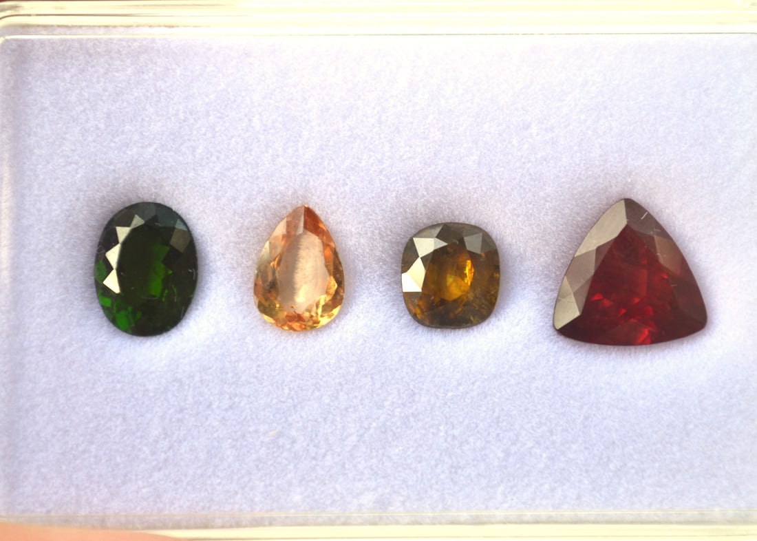 7.56 Carats of Jewelry Grade Mixed Gems: Just a gorgeous set of gems here. All top quality. Included is a 1.20 Carat Apricot colored Imperial Topaz, a 1.80 Carat Chrome Diopside, a 1.76 Carat Sphene, and a 2.80 Carat rich Red Sunstone. Just 