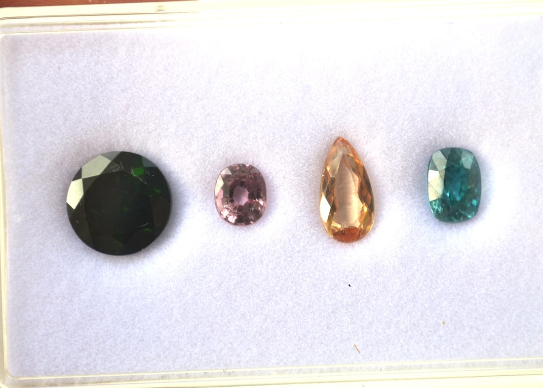 8.11 Carats of Jewelry Grade Mixed Gems: Fantastic set of gems here. All top quality. Included is a 1.92 Carat Blue Zircon, a 1.30 Carat Apricot colored Imperial Topaz, a 0.74 Carat Bubblegum Pink Spinel, and a large 4.15 Carat Chrome Diopsi