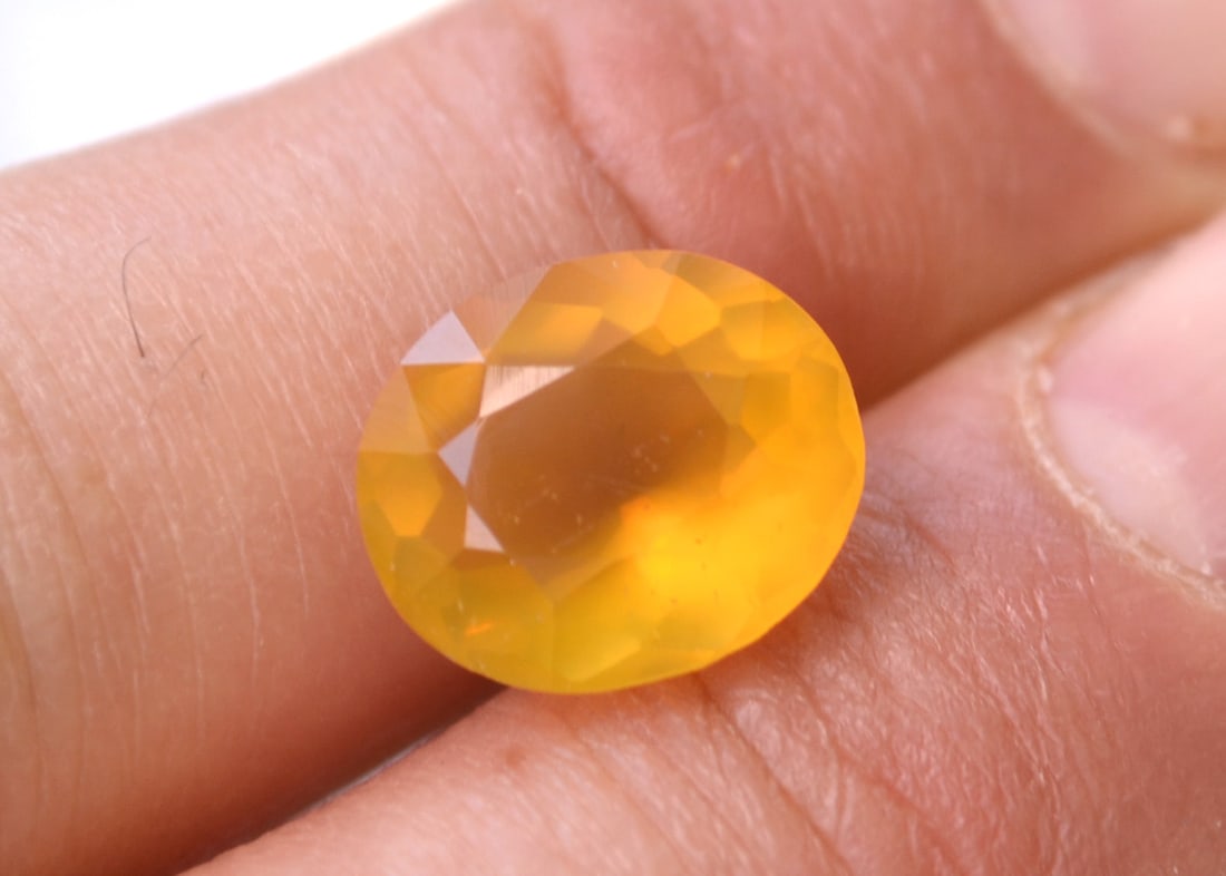 4.55 Carat Oval Cut Opal: Beautiful Opal. Great color. Perfect for jewelry. The high magnification photos show some inclusions in the stone that are mostly invisible to the naked eye. This is a really spectacular stone in