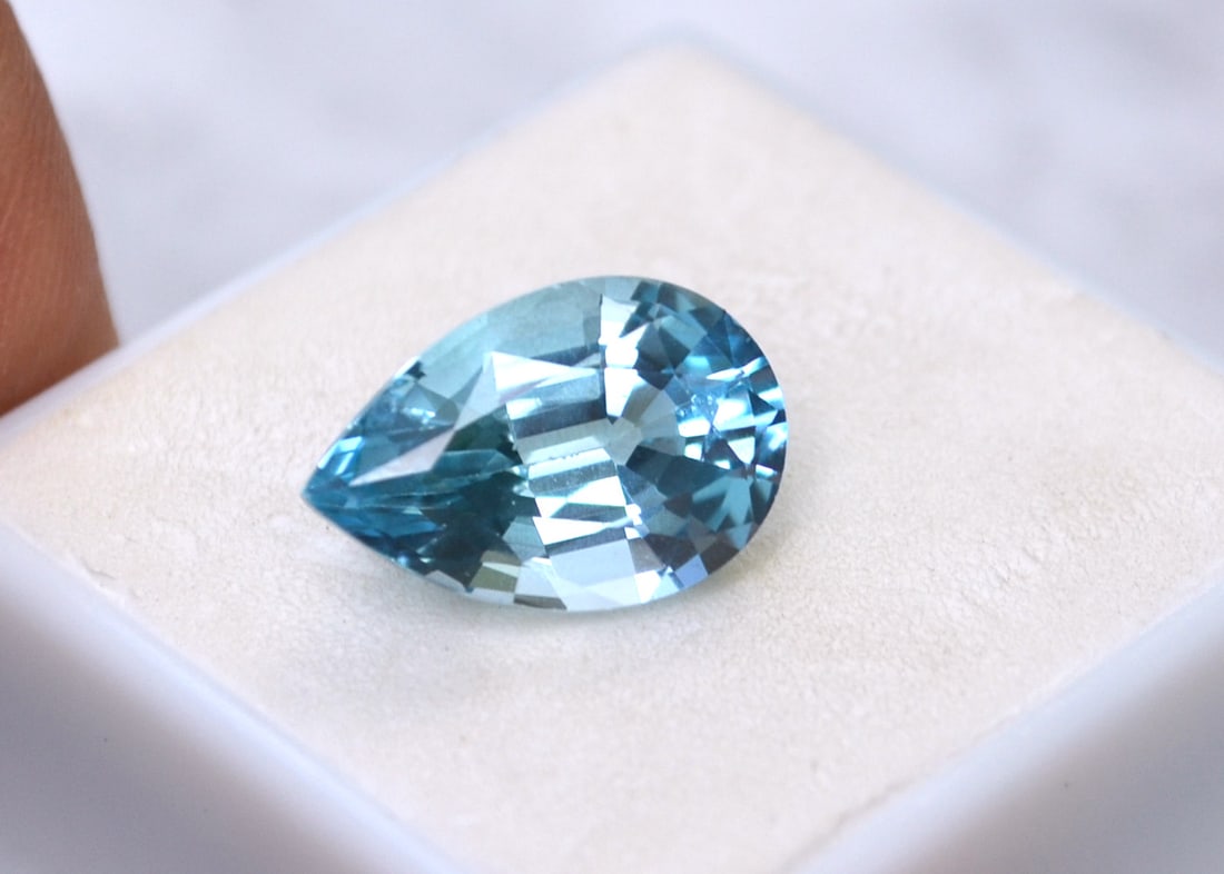 7.24 Carat Pear Cut Sky Blue Topaz: Fine Topaz. Great cut and nice light Sky Blue color. Natural stone but heated and irradiated to get its color, as all Blue Topaz are. This is an industry accepted practice applied to all Blue Topaz.