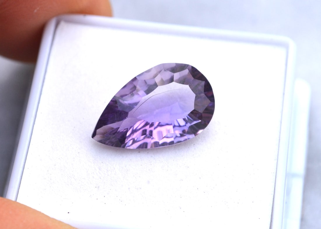 5.64 Carat Fancy Pear Cut Jewelry Grade Amethyst: Gorgeous Amethyst. Great color and a beautiful fancy cut. Just a top stone. Natural and untreated. Most gems sold online aren't jewelry grade. They're either poorly cut, have weak color or too many