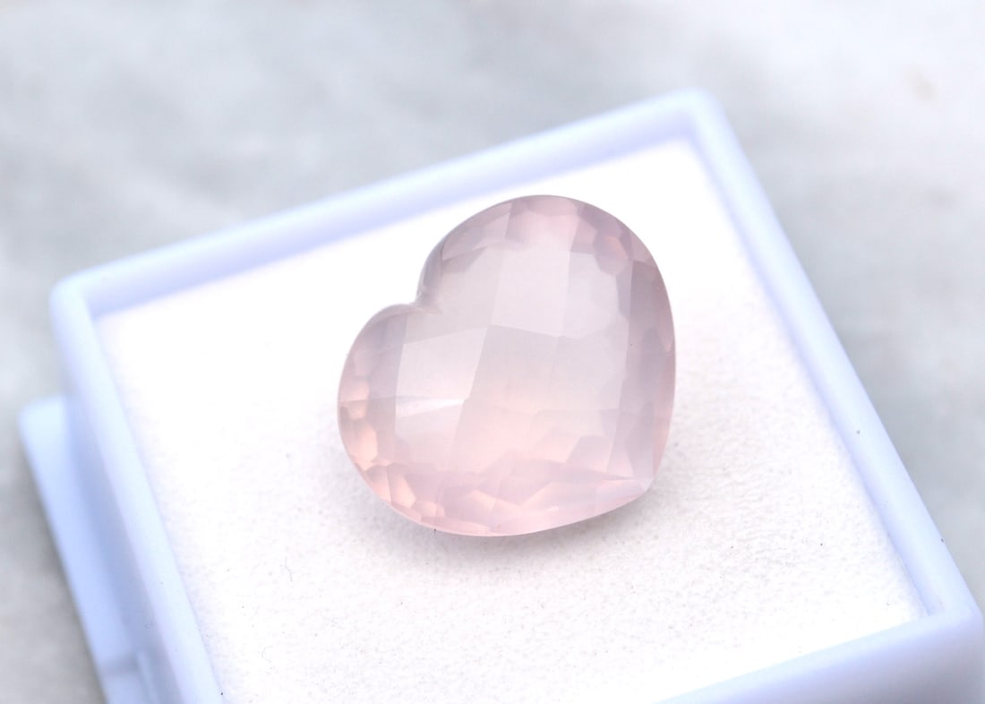11.95 Carat Heart Cut Rose Quartz: Beautiful example of a Rose Quartz. Strong pink color and a great cut. A bit cloudy, as all faceted Rose Quartz are, but much more transparent than most. Natural and untreated. Most gems sold online