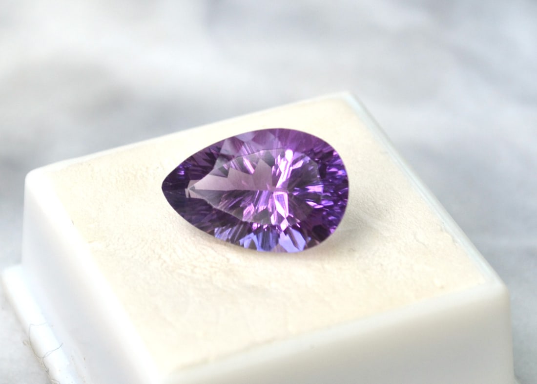 8.82 Carat Fancy Pear Cut Amethyst: Fine Amethyst. Rich color, clean and fantastically cut. Perfect size for jewelry. Just an amazing stone for the price. Natural and untreated. Most gems sold online aren't jewelry grade. They're