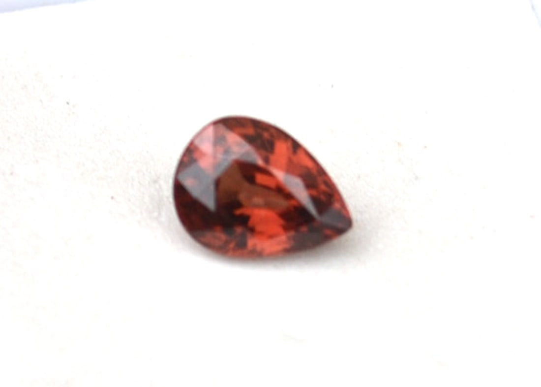 2.00 Carat Pear Cut Orangy Red Zircon: Great Zircon. Beautiful orangy red color. Just a great stone for the price. Zircon is a natural stone, not to be confused with Cubic Zirconia. Natural and untreated. For Proxibid bidders, shipping is