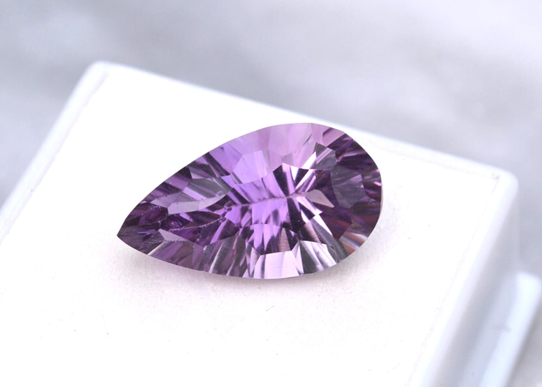 9.17 Carat Fancy Pear Cut Amethyst: Beautiful Amethyst with a fine, fancy cut. Just a top quality stone. Natural and untreated. For Proxibid bidders, shipping is a flat rate of $6, no matter how many lots won. For Live Auctioneers
