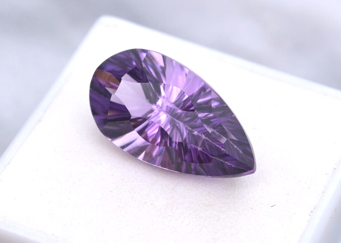 10.27 Carat Fancy Pear Cut Amethyst: Beautiful Amethyst with a fine, fancy cut. Just a top quality stone. Natural and untreated. For Proxibid bidders, shipping is a flat rate of $6, no matter how many lots won. For Live Auctioneers