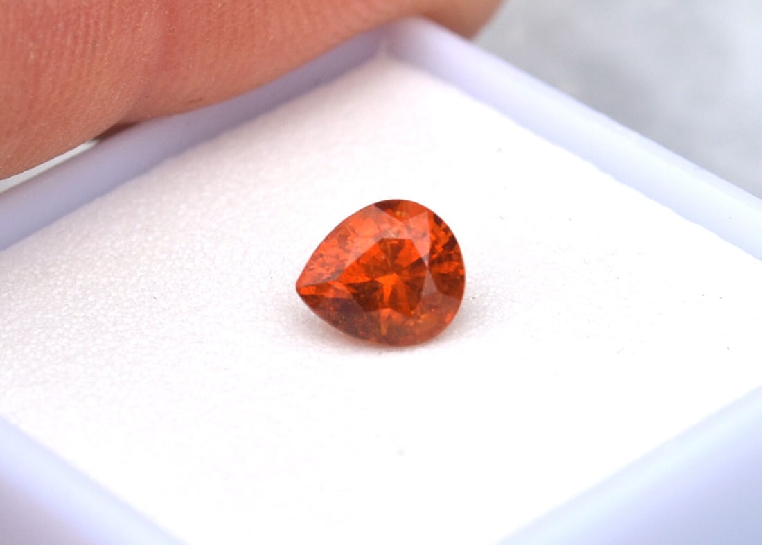 1.48 Carat Pear Cut Spessartite Garnet: Gorgeous Spessartite with top Mandarin Orange color. Some scattered inclusions, but that's very common with this rare form of Garnet. Natural and untreated. For Proxibid bidders, shipping is a flat