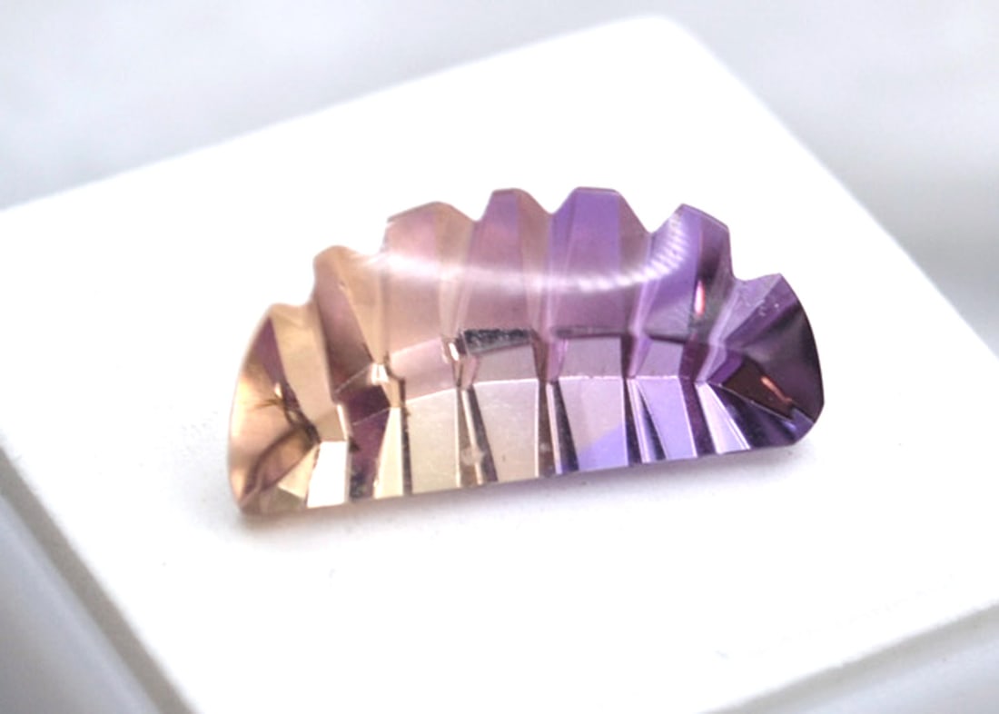 7.63 Carat Fancy Cut Ametrine: Beautiful Ametrine here with a fine fancy laser cut. Just a great stone for the price. Ametrine is a natural stone that has the purple of Amethyst and the orange of Citrine. Natural and untreated.