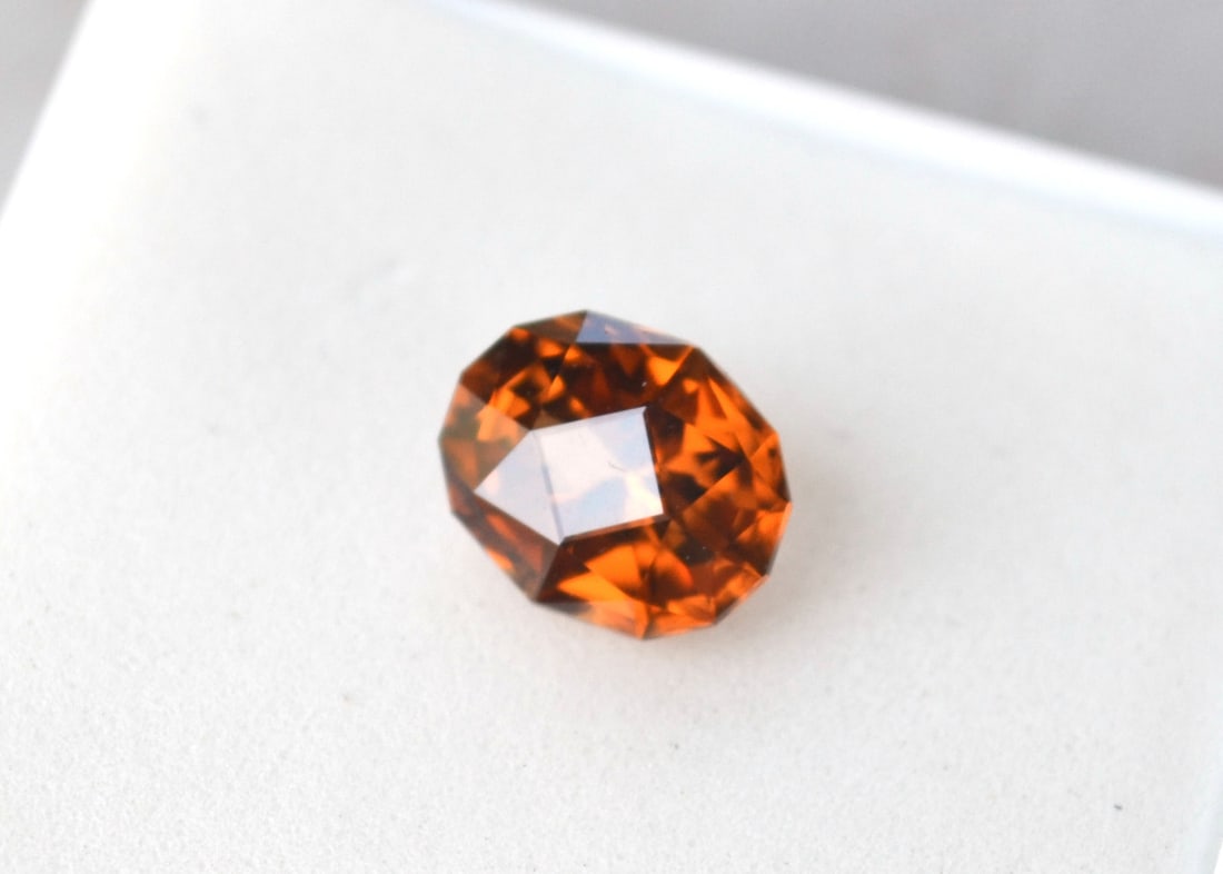 2.70 Carat Fancy Oval Cut Orange Zircon: Fine Zircon with great color and a fantastic cut. Zircon is a natural stone, not to be confused with Cubic Zirconia. Natural and untreated. For Proxibid bidders, shipping is a flat rate of $6, no