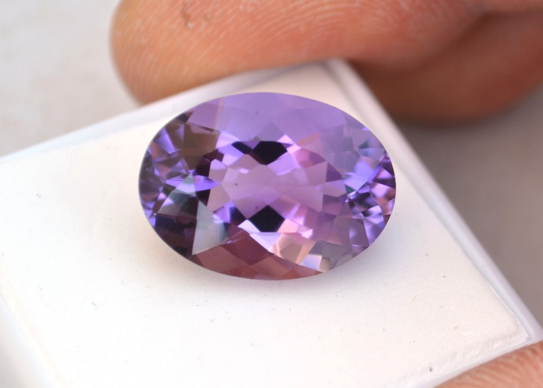 12.37 Carat Oval Cut Amethyst: Great Amethyst. Nice color and cut. Natural and untreated gemstone. Most gemstones bought online aren't very high quality. They're generally poorly cut, have weak color and too many inclusions. In