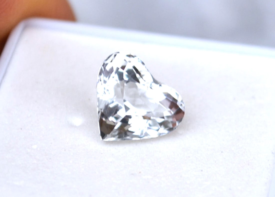 3.68 Carat Heart Cut Colorless Aquamarine -- Goshenite: Fine example of a colorless Aquamarine, also known as Goshenite. This is a fantastically cut stone, perfect for jewelry. Natural and untreated. For Proxibid bidders, shipping is a flat rate of $6, no