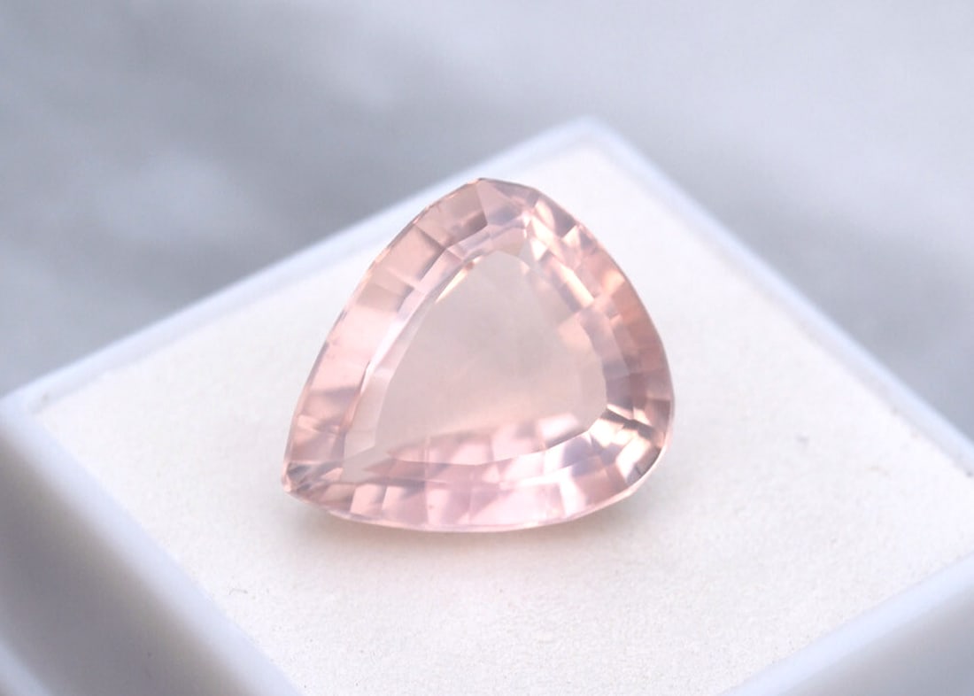 12.92 Carat Fancy Pear Cut Rose Quartz: Fantastic example of a gem quality Rose Quartz. Nearly 100% of the Rose Quartz mined is too cloudy or weakly colored to be considered gem quality, and are mostly turned into cabochons. It's very rare