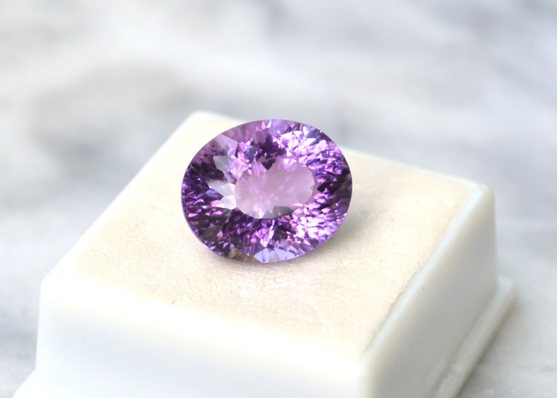 14.38 Carat Fancy Oval Cut Amethyst: Fine Amethyst. Rich color, clean and fantastically cut. Perfect size for jewelry. Just an amazing stone for the price. Natural and untreated. Most gems sold online aren't jewelry grade. They're