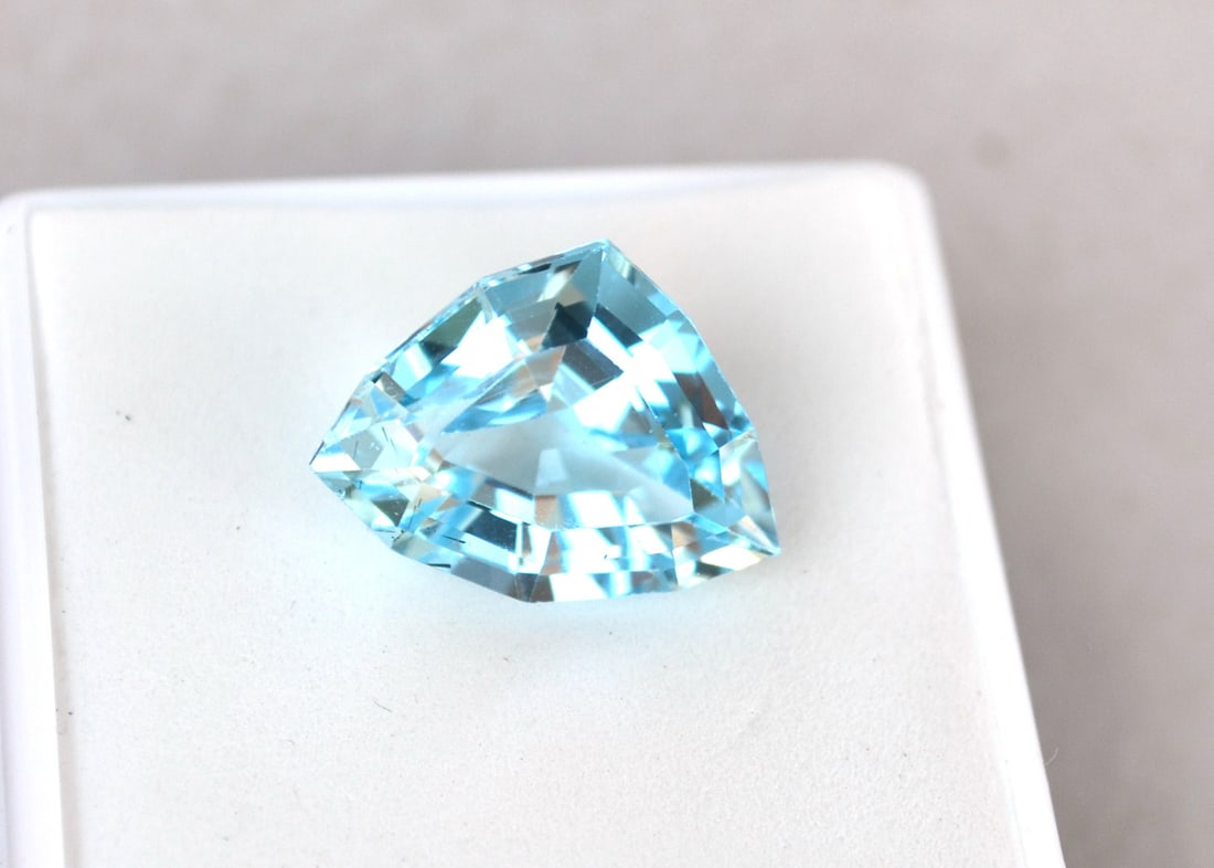 10.16 Carat Fancy Trillion Cut Sky Blue Topaz: Gorgeous Topaz. Natural stone. All Blue Topaz are heated and irradiated to get their color. This is an industry accepted standard applied to all Blue Topaz. Most gemstones bought online aren't very hi