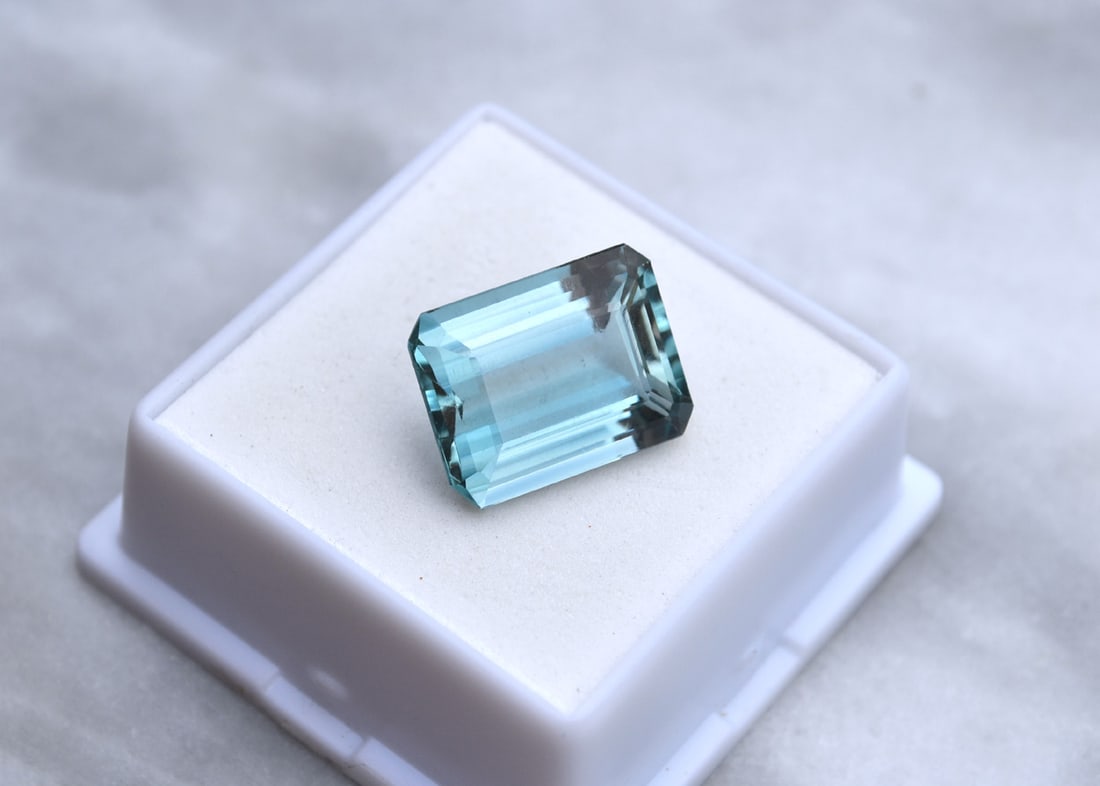 13.80 Carat Octagon Cut Blue-Green Topaz: Exceptional Topaz with very rare shade of Blue-Green. Natural stone but heated and irradiated to get its color, as all Blue Topaz are. This is an industry accepted practice applied to all Blue Topaz.