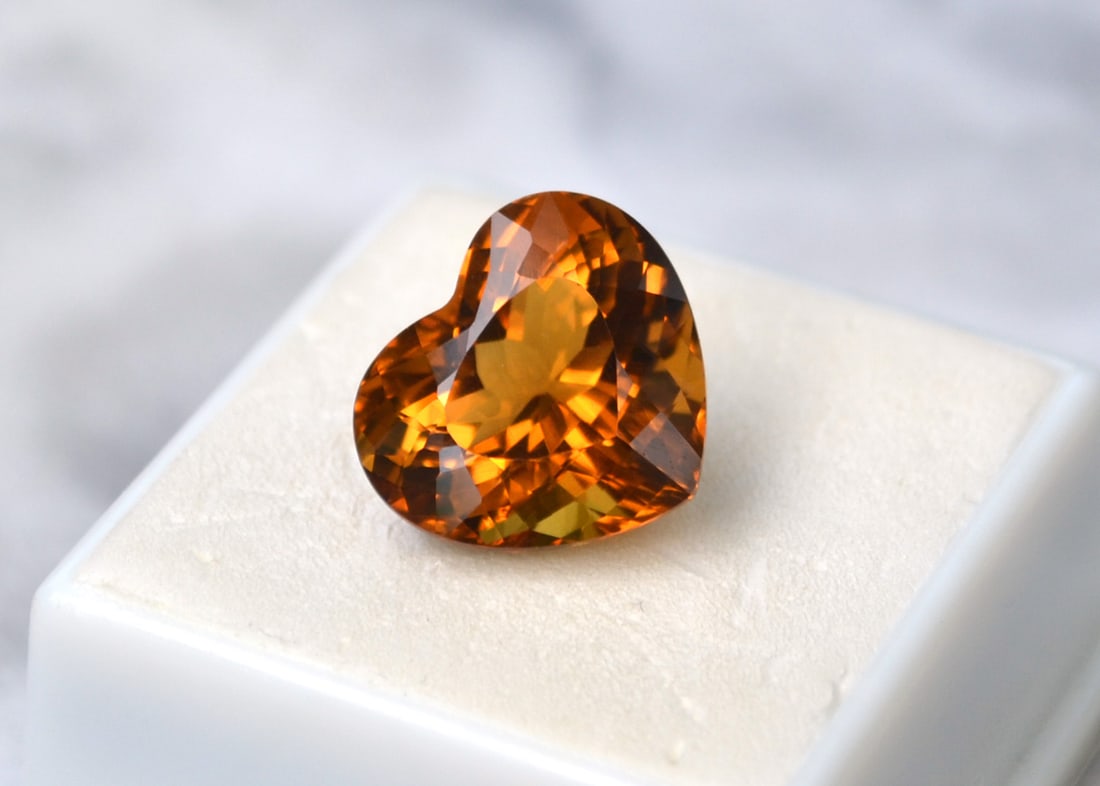 11.42 Carat Heart Shaped Citrine: Fantastic Citrine. One of the nicest we've had. Just exceptional in every way. Natural and untreated. Most gems sold online aren't jewelry grade. They're either poorly cut, have weak color or too many