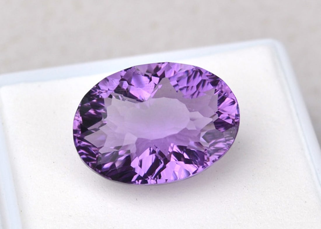 13.00 Carat Fancy Oval Cut Amethyst: Fine Amethyst with a great fancy cut. Just a superb stone. Natural and untreated. For Proxibid bidders, shipping is a flat rate of $6, no matter how many lots won. For Live Auctioneers bidders,