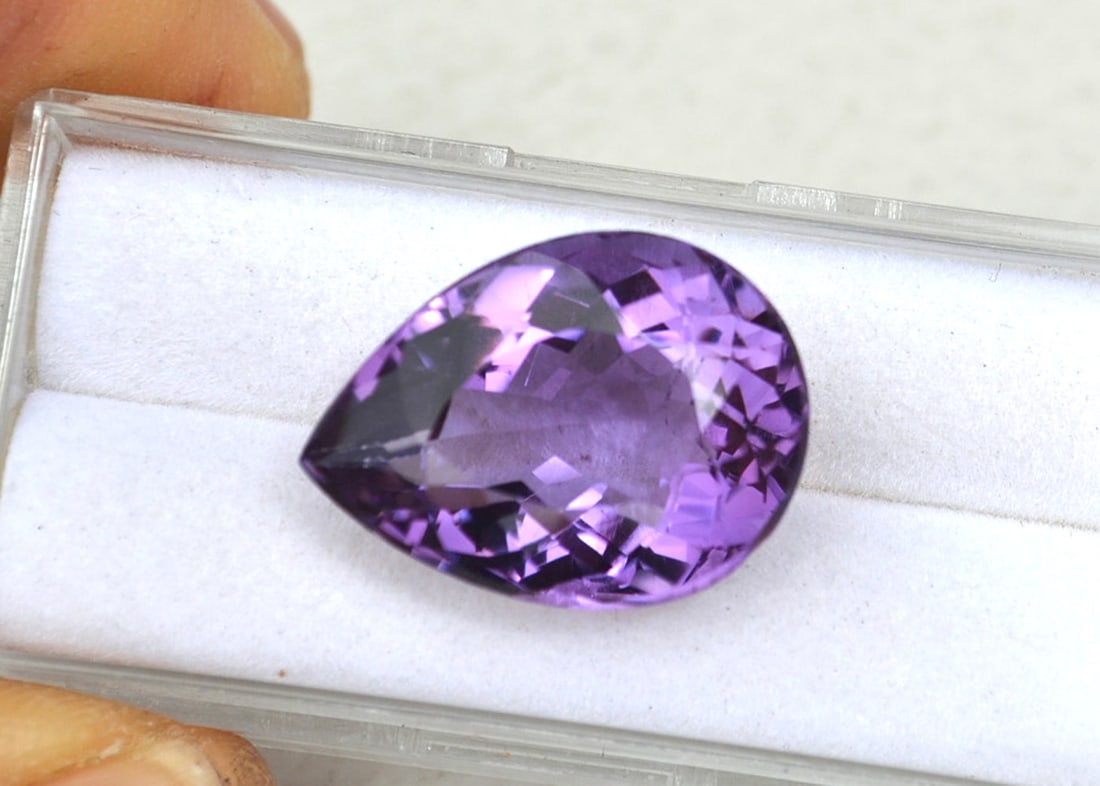 16.09 Carat Pear Cut Amethyst: Beautiful Amethyst with rich color and a great cut. Great size for use in a pendant. Natural and untreated. For Proxibid bidders, shipping is a flat rate of $6, no matter how many lots won. For Live