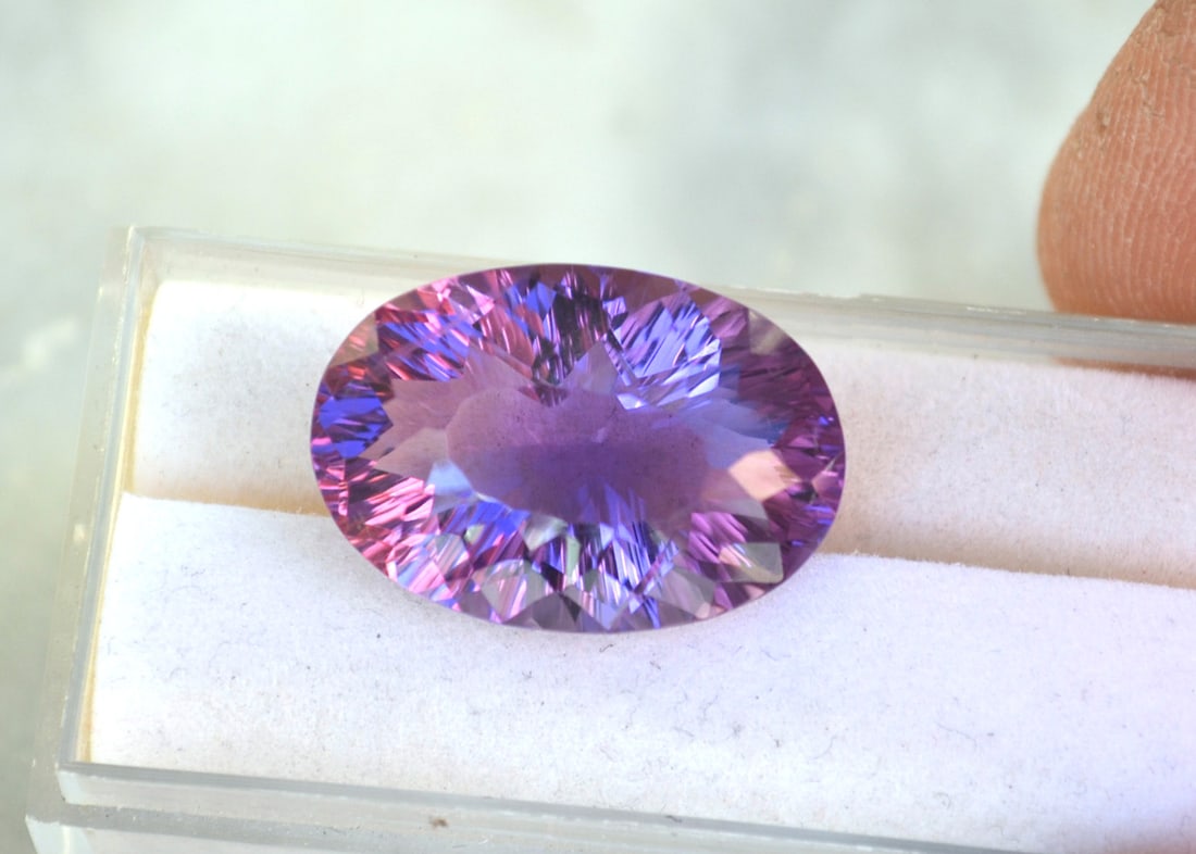 16.37 Carat Fancy Oval Cut Amethyst: Fine Amethyst with a great fancy cut. Just a superb stone. Natural and untreated. For Proxibid bidders, shipping is a flat rate of $6, no matter how many lots won. For Live Auctioneers bidders,