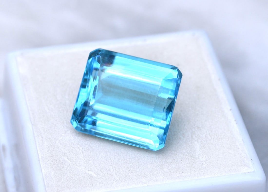 17.20 Carat Octagon Cut Sky Blue Topaz: Beautiful Topaz with an intense Sky Blue color. Just a great stone for the price. Natural stone but heated and irradiated to get its color as all Blue Topaz are. This is an industry accepted practice