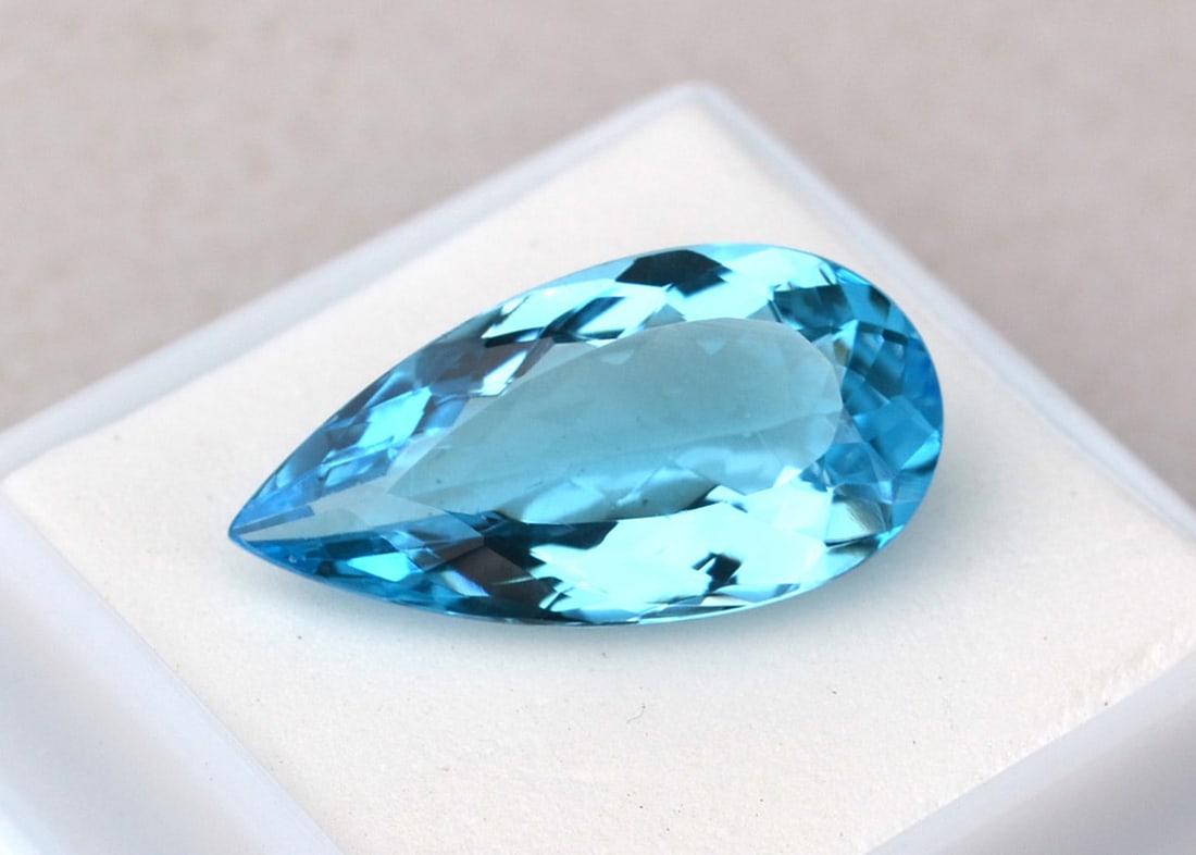 16.20 Carat Pear Cut Sky Blue Topaz: Beautiful Topaz with fine color, clarity and a great cut. Just a great stone for the price. Natural stone but heated and irradiated to get its color, as all Blue Topaz are. This is an industry
