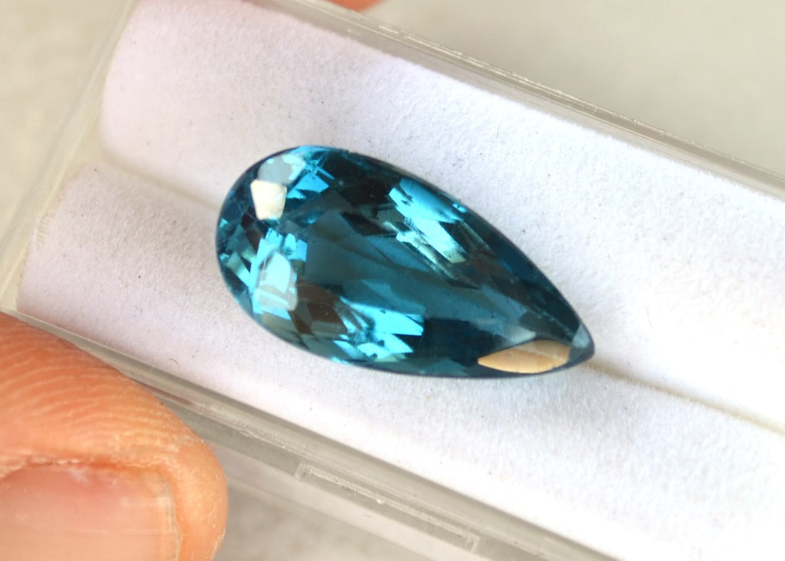 14.60 Carat Pear Cut London Blue Topaz: Beautiful Topaz with fine color, clarity and a great cut. Just a great stone for the price. Natural stone but heated and irradiated to get its color, as all Blue Topaz are. This is an industry
