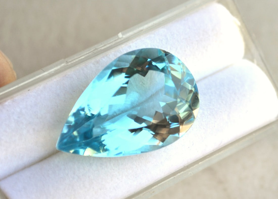 22.86 Carat Pear Cut Sky Blue Topaz: Just a beautiful Sky Blue Topaz here. Natural stone but heated and irradiated to get its color, as all Blue Topaz are. This is an industry accepted practice applied to all Blue Topaz. Most gems sold