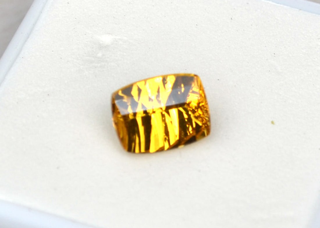 1.65 Carat Fancy Cushion Cut Heliodor: Nice example of a Heliodor. Heliodor is in the Beryl family, along with Emerald and Aquamarine. It's sometimes referred to as Yellow Aquamarine. So, as you can imagine, the value is quite high. Very